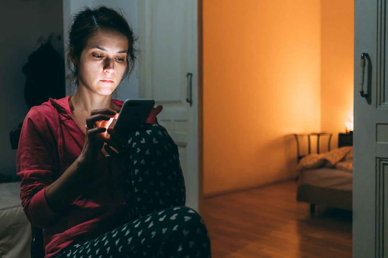 woman looking at phone